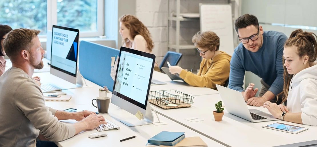 Image of people working together in the office.