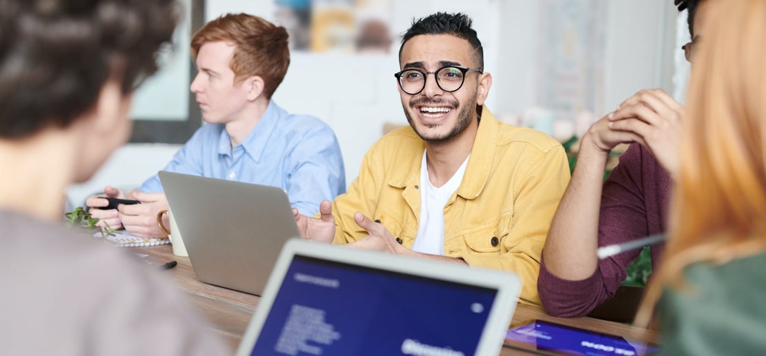 Image of people working together in the office.